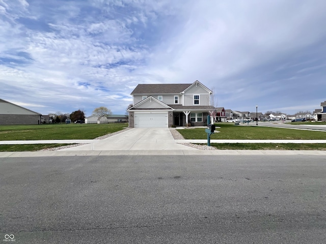 view of front of property with a front lawn and a garage