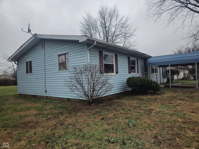 7071 S Charles Pl, Terre Haute, IN 47802 - view of property exterior with a lawn and a carport