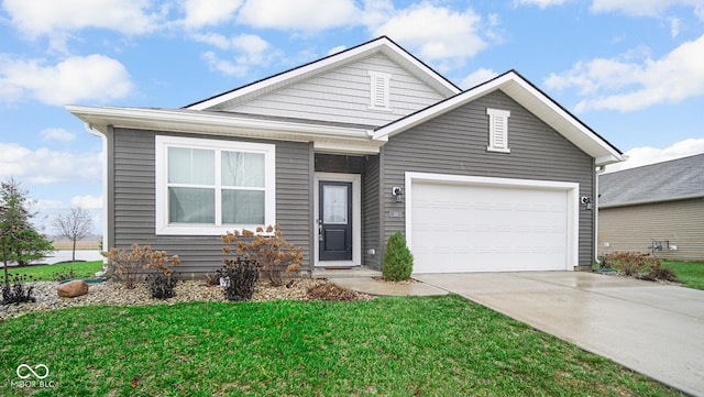 view of front of home featuring a garage and a front yard