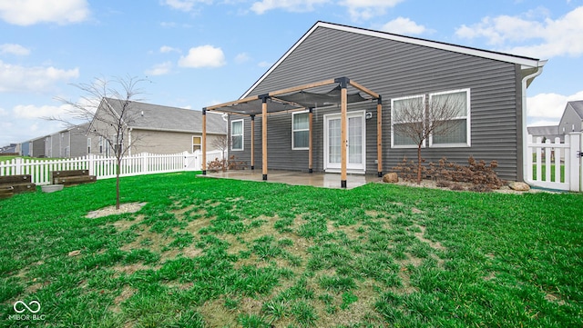 back of house featuring a yard, a pergola, and a patio area