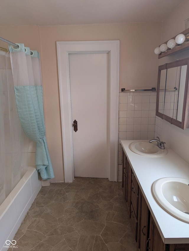 bathroom featuring vanity and shower / bathtub combination with curtain