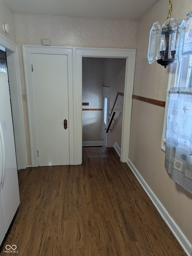 corridor featuring dark hardwood / wood-style floors