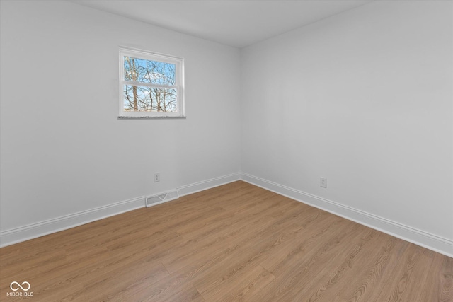 unfurnished room with light hardwood / wood-style flooring