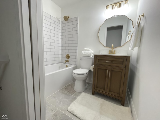 full bathroom with vanity, toilet, and tiled shower / bath