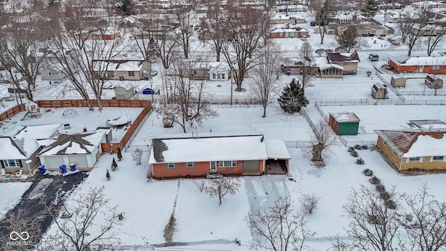 snowy aerial view featuring a residential view