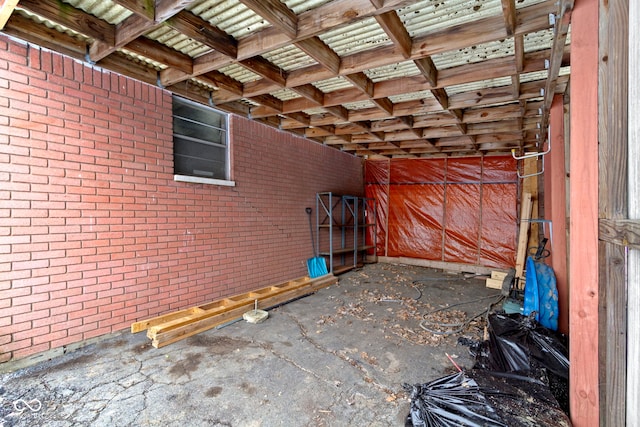 exterior space featuring brick wall