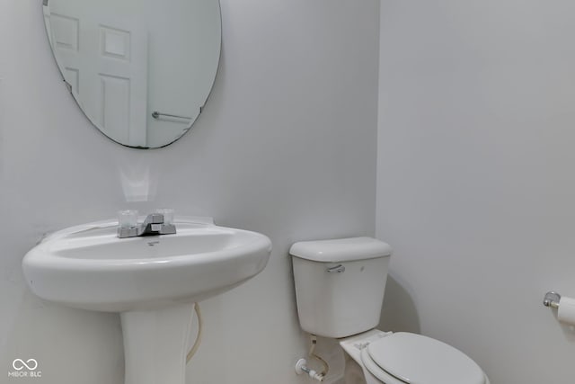 bathroom featuring sink and toilet