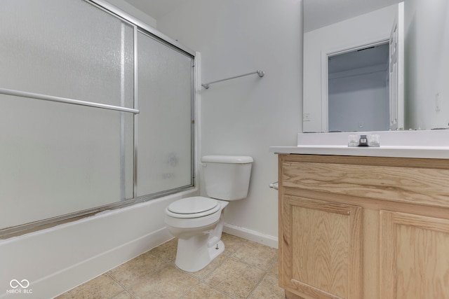 full bathroom with tile patterned flooring, vanity, toilet, and combined bath / shower with glass door