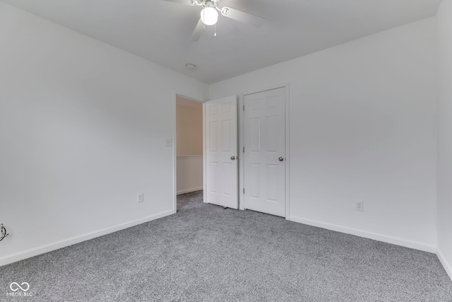 interior space featuring carpet and ceiling fan