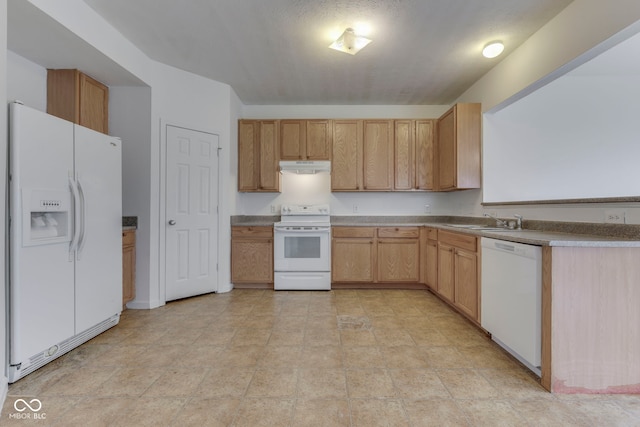 kitchen with sink, white appliances, and light brown cabinets