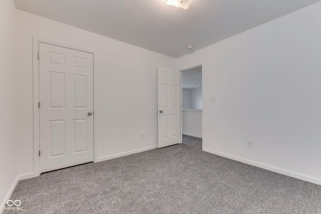 unfurnished bedroom with carpet