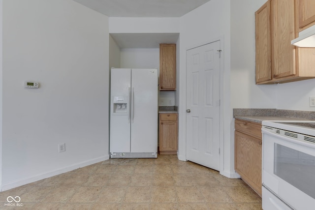 kitchen with light brown cabinets and white appliances