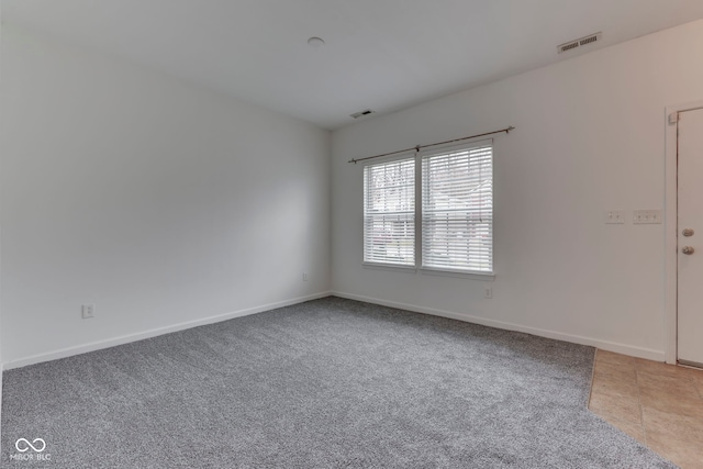 empty room featuring carpet floors