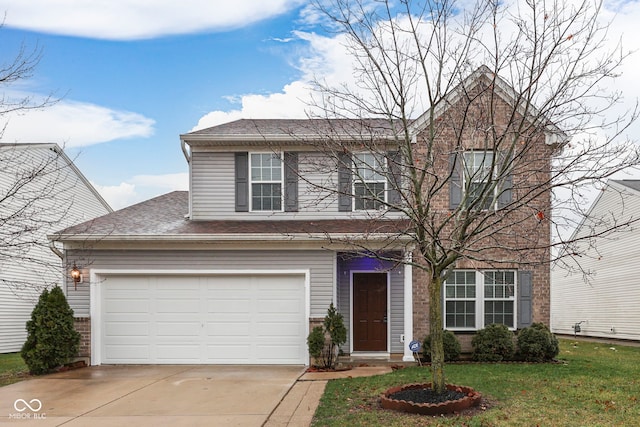 view of front facade with a garage and a front yard