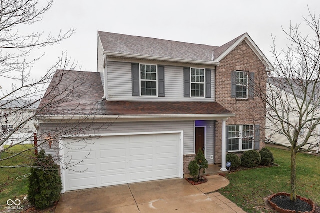 view of front of home with a garage and a front lawn