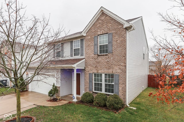 view of front of home with a garage and a front lawn