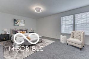 bedroom featuring carpet and multiple windows