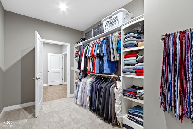 spacious closet with carpet floors