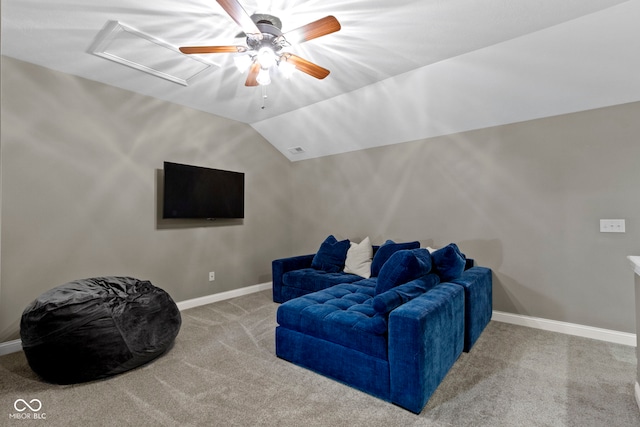 sitting room with carpet flooring and vaulted ceiling