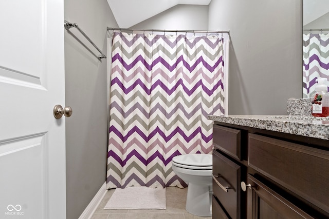 bathroom with vanity, a shower with shower curtain, vaulted ceiling, and toilet