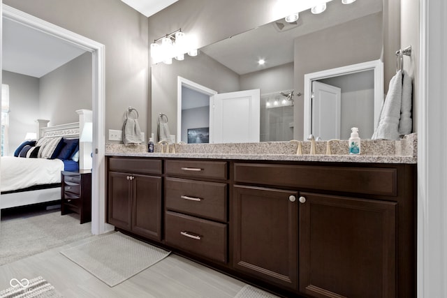 bathroom with vanity and walk in shower