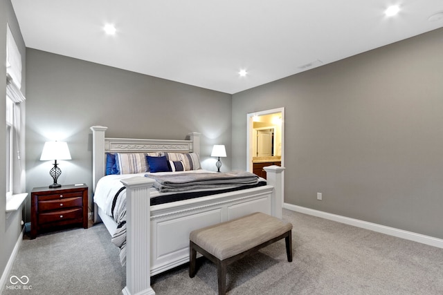 carpeted bedroom with ensuite bath