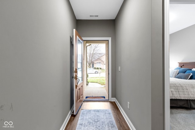 doorway featuring dark hardwood / wood-style floors