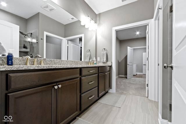 bathroom with vanity and walk in shower