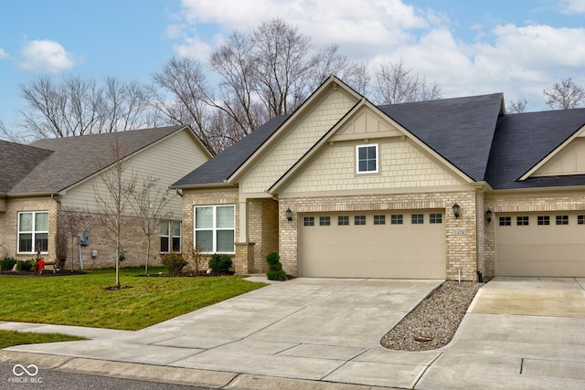 craftsman-style house featuring a front yard and a garage