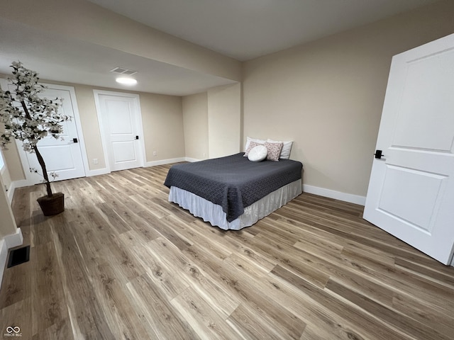 bedroom featuring wood-type flooring