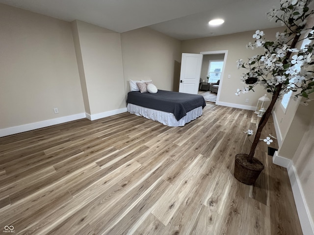 bedroom with hardwood / wood-style floors