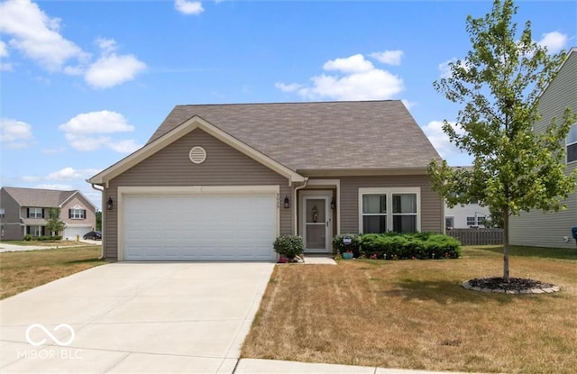 view of front of home with a garage and a front yard