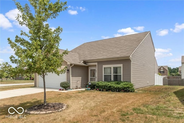 view of front of house with a garage and a front yard