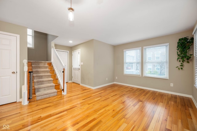 unfurnished living room with light hardwood / wood-style flooring