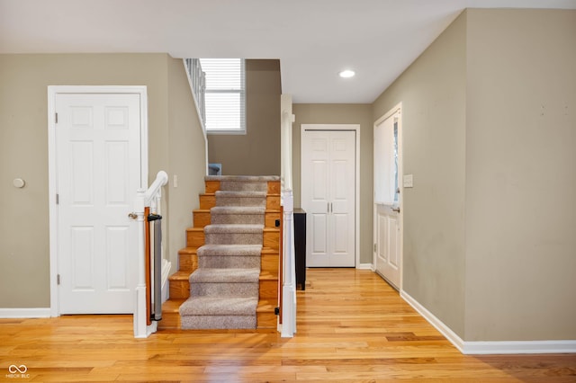 stairway featuring hardwood / wood-style flooring