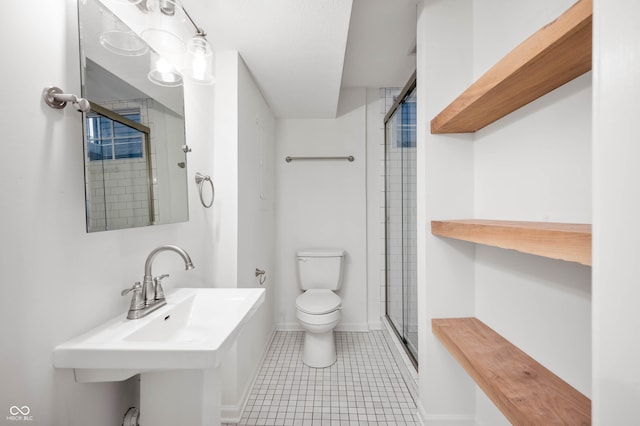 bathroom featuring an enclosed shower, sink, toilet, and tile patterned floors