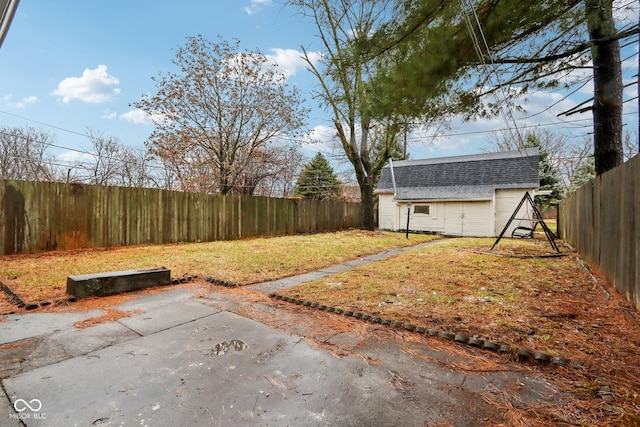 view of yard featuring a patio area and an outdoor structure