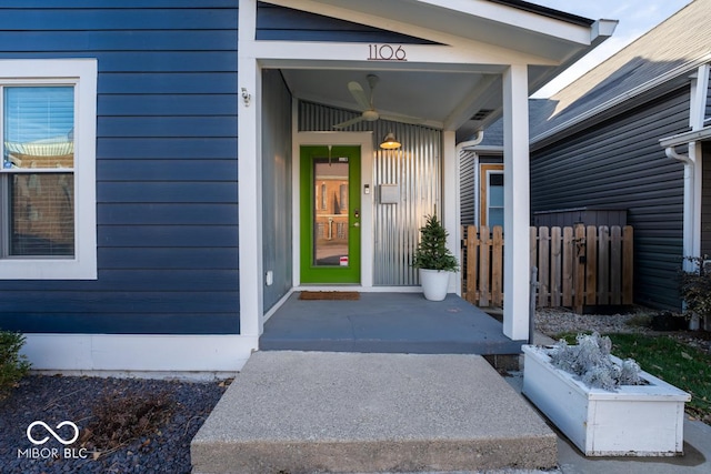 view of exterior entry with a porch