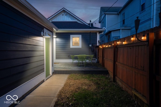 yard at dusk with a wooden deck