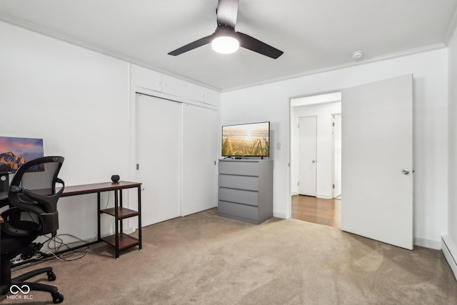 office with baseboard heating, crown molding, ceiling fan, and light colored carpet