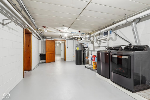 basement with washing machine and dryer and water heater