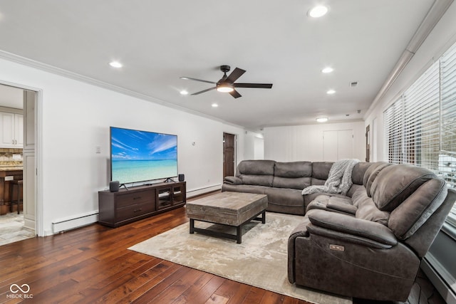 living room featuring hardwood / wood-style floors, ceiling fan, crown molding, and a baseboard radiator