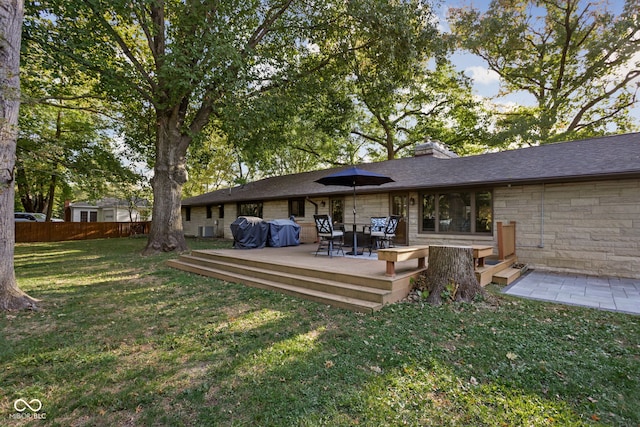 exterior space with a yard and a wooden deck