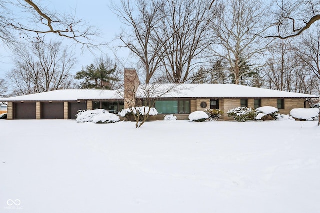 ranch-style home featuring a garage