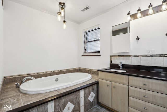 bathroom featuring vanity, crown molding, and a washtub