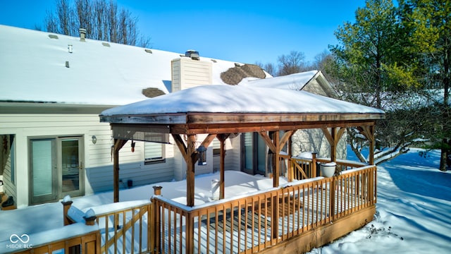 view of snow covered deck