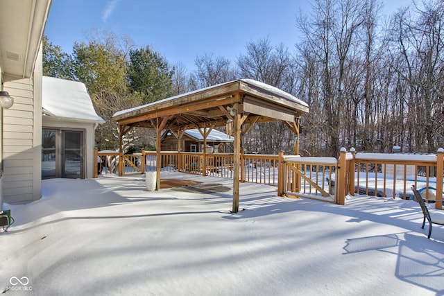 snow covered deck featuring a gazebo