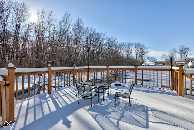 view of snow covered deck