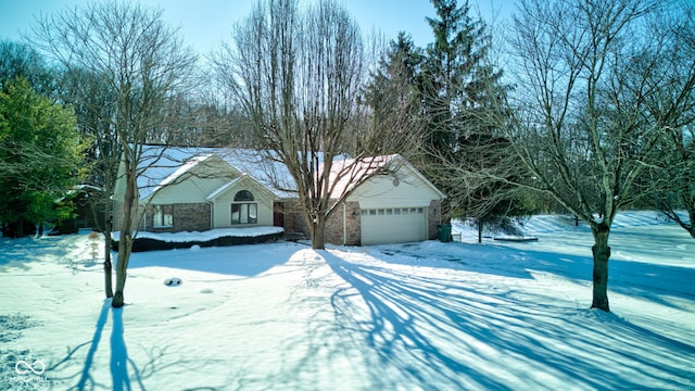 ranch-style home featuring a garage