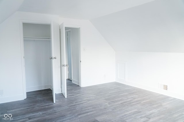 bonus room featuring dark hardwood / wood-style floors and lofted ceiling